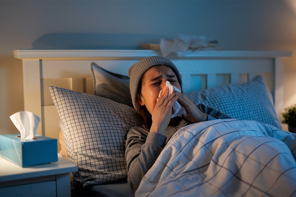 Snotteren en snoozen: Tips voor slapen met verkoudheid
