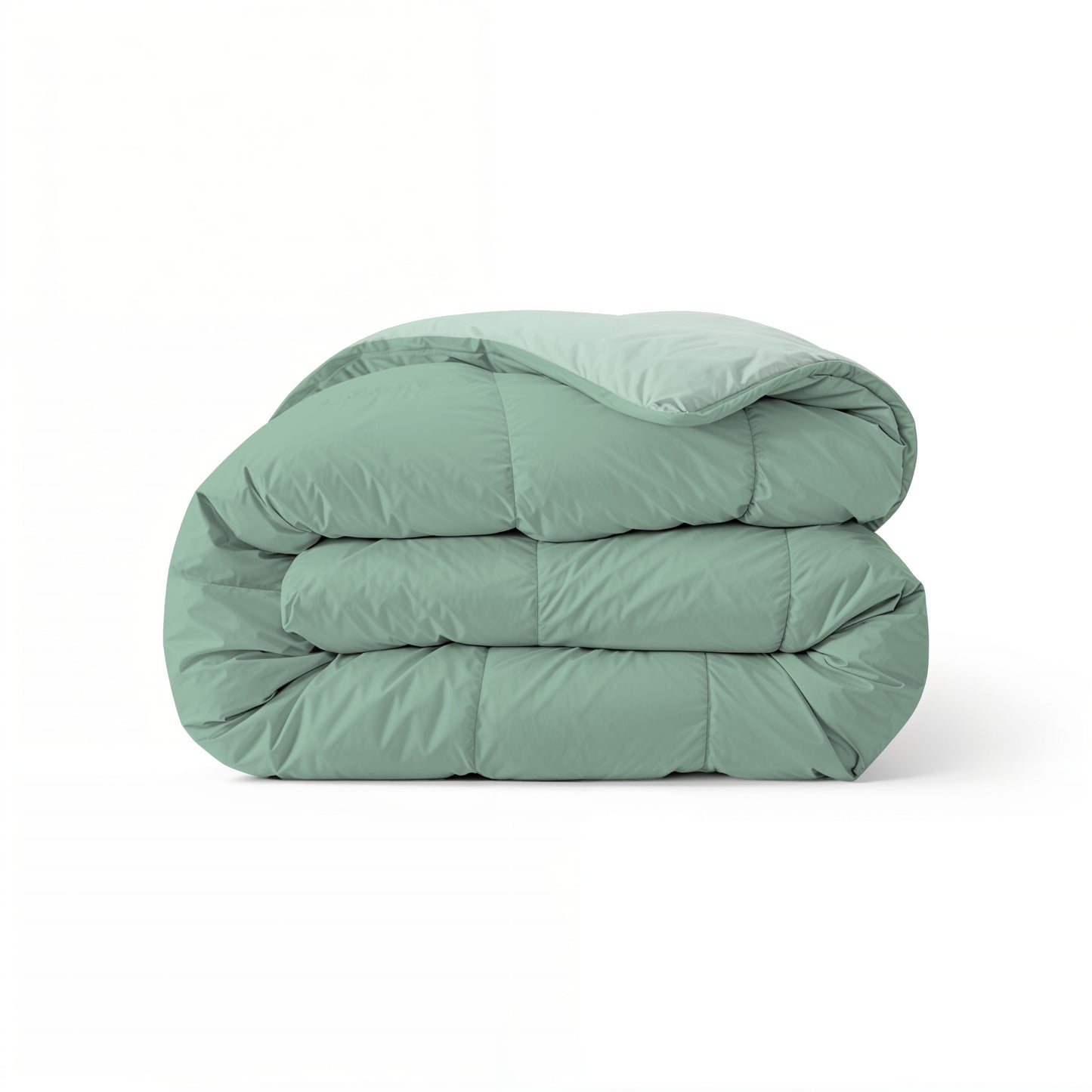 Het Zelesta Comfort Duo Dekbed in mintgroen en lichtgroen is netjes gevouwen op een witte achtergrond.