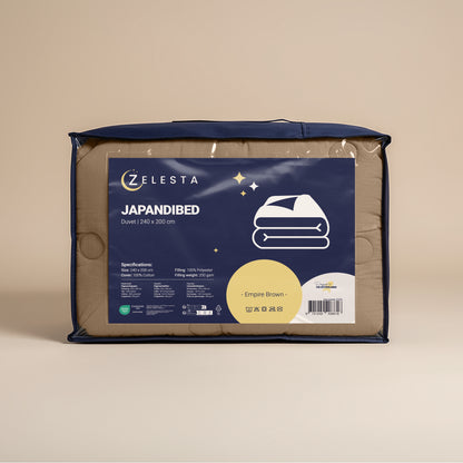 Een verpakt Zelesta Japandibed Katoen Mousseline - Bruin 2-in-1 dekbed, 240x200 cm, wordt getoond tegen een neutrale achtergrond.